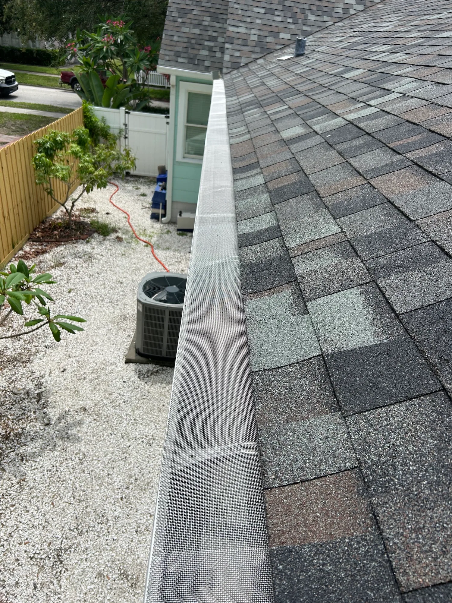Gutter guard rooftop view side yard ac unit, Sanford
